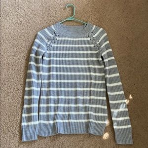 Women’s grey and white striped sweater.